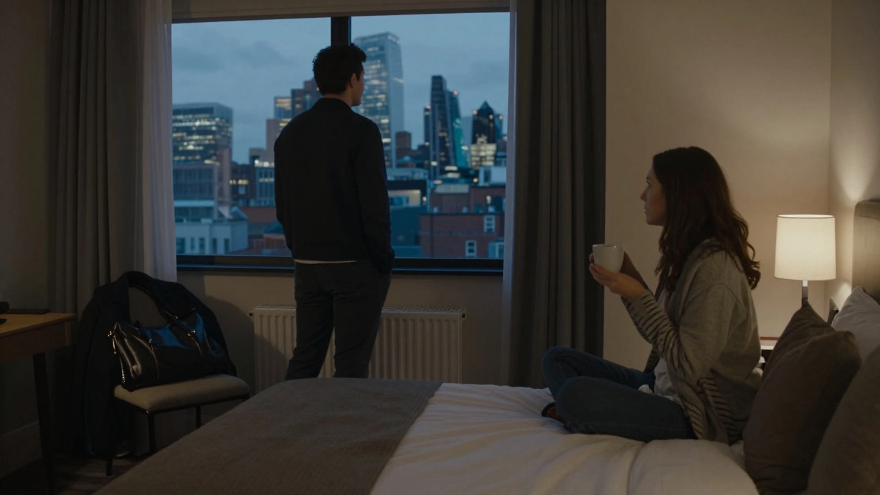 A couple in a private hotel room at dusk, one looking out the window, calm and respectful atmosphere.